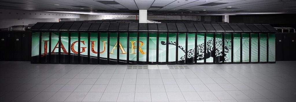 Rows of supercomputer cabinets inside a high-performance computing centre